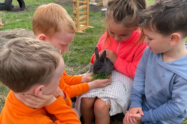 Children holding a bunny